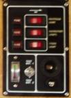 Switch panel with dodgy voltmeter, voltmeter switch and cigar lighter socket